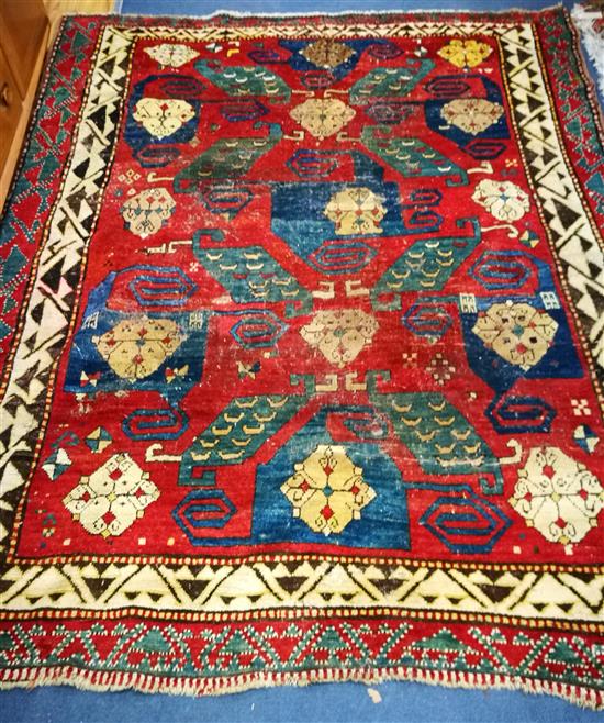 A Caucasian brick red ground rug 208 x 170cm